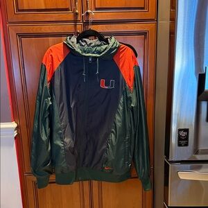 Vintage Nike Miami Hurricanes green and orange team sports windbreaker jacket